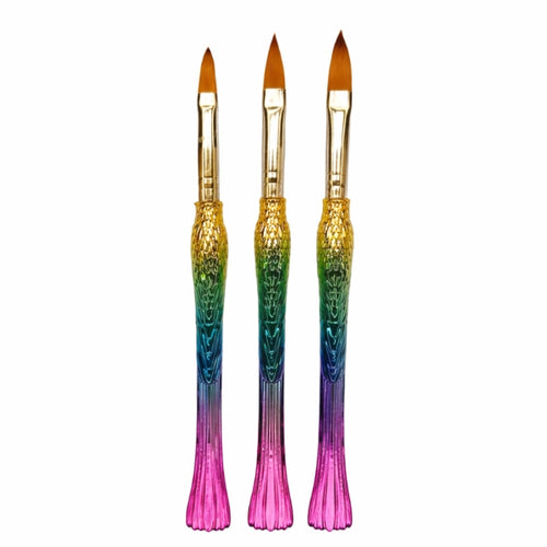 Three acrylic nail brushes with rainbow mermaid tail handles, gold-tone ferrules and pointed brown bristles.