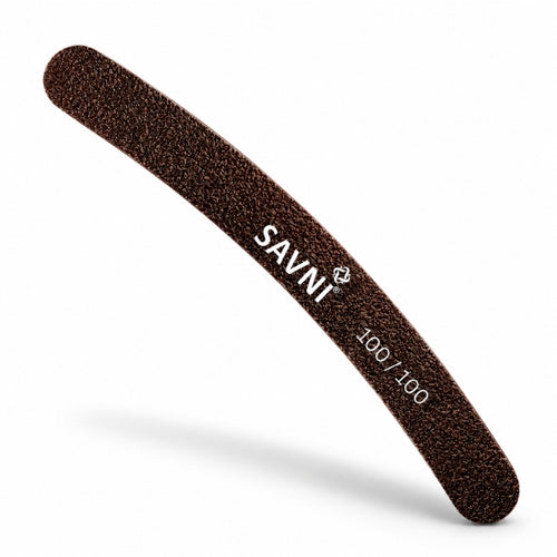 SAVNI banana nail file with a dark brown abrasive surface, curved shape, rounded ends and white 100/100 grit marking.