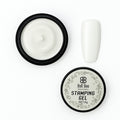 Bolt Bee Nail Art Stamping Gel in a round black jar, shown open with white gel inside next to a white artificial nail tip, and the lid below with the Bolt Bee logo and product name. USE IN NAIL ART EXTENTION