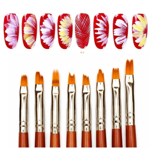 Eight flat nail art brushes with orange bristles and reddish-brown handles are shown below eight sample nail decals featuring floral and leaf patterns in red, pink, yellow, and white on a plain white background.