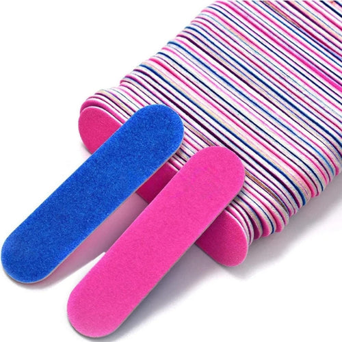 Pink and blue mini nail files with rounded ends and textured surfaces, shown stacked with two files in front.