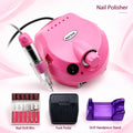 Pink electric nail drill and polisher kit with handpiece, drill bits, foot pedal and purple handpiece stand.