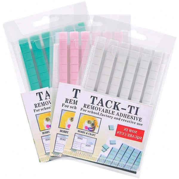 Removable adhesive putty in green, pink and white pre-cut squares, shown in three clear hanging packs labelled TACK-TI.