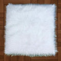 White fluffy mat with a square shape, dense long fibres and shaggy edges, laid flat for nail art display.